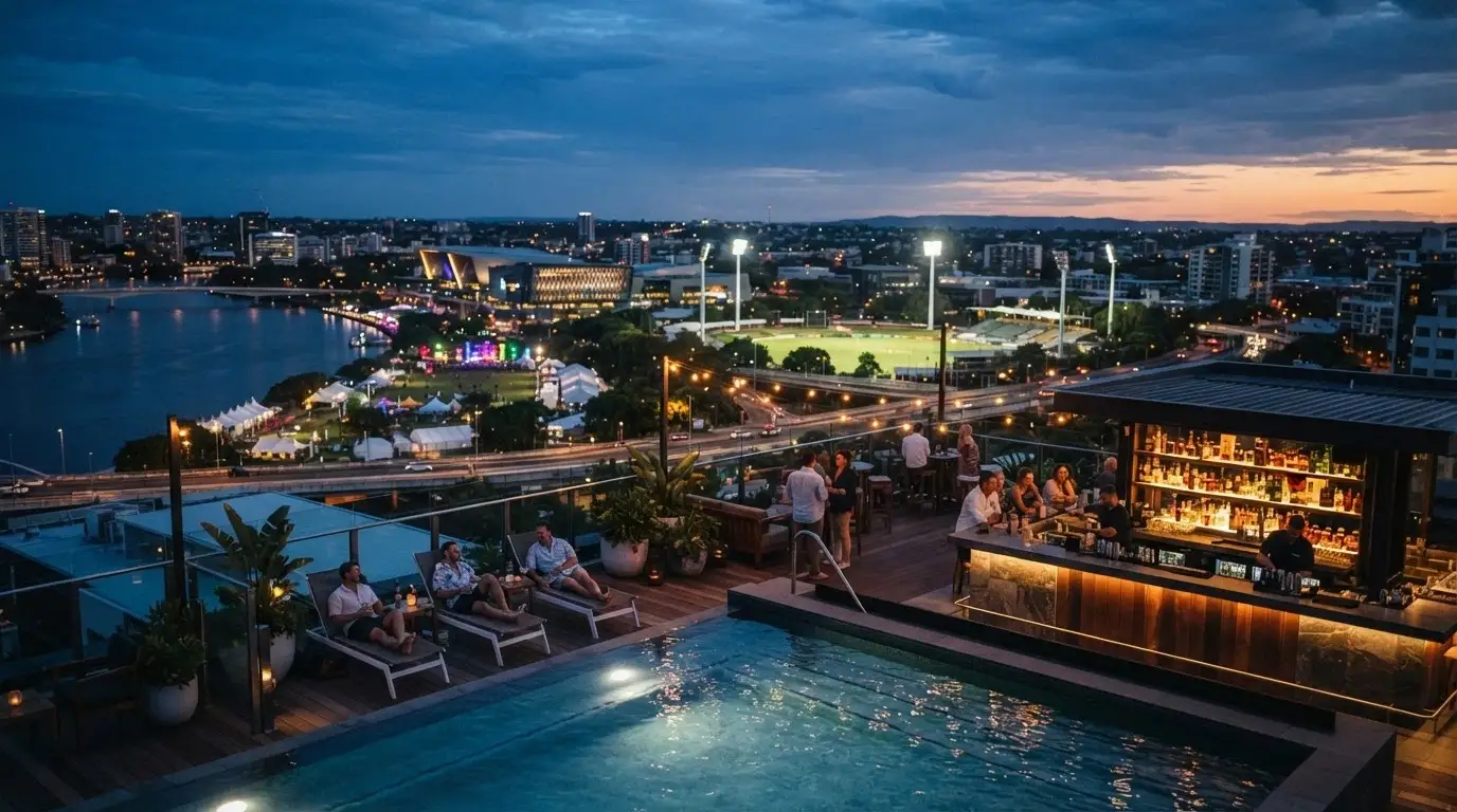 The Eos rooftop bar and pool at dusk, with the Adelaide skyline and Riverbank precinct as backdrop